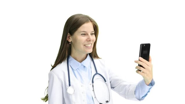 Female doctor, close-up, on a white background, with a phone