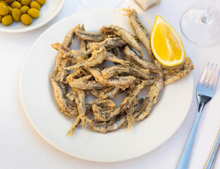 Dish with fried sardines, pilchards or anchovies in batter for a traditional Spanish meal