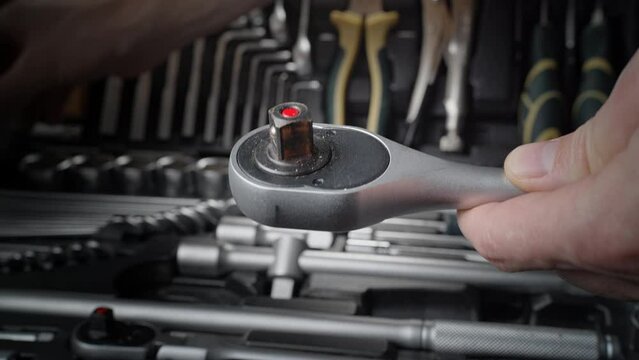 Professional chrome ratchet wrench in tool case. Essential car repair tool.