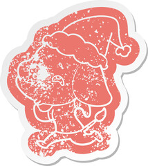 cartoon distressed sticker of a elephant remembering wearing santa hat