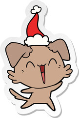 happy little dog sticker cartoon of a wearing santa hat