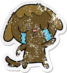 distressed sticker of a cute cartoon dog crying