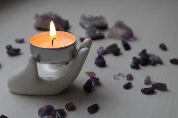 Candle light and Amethyst kiesel. Relaxation background. 