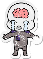 Obraz na płótnie Canvas distressed sticker of a cartoon big brain alien crying