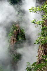 Clouds float amidst the Second Ring Road in West Sea (Xihai) Grand Canyon of Huangshan Yellow Mountains.