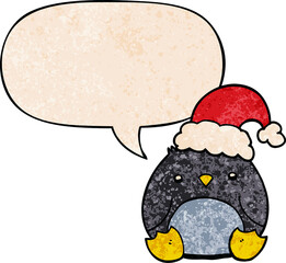 cute cartoon penguin wearing christmas hat and speech bubble in retro texture style