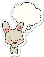cartoon rabbit talking and thought bubble as a printed sticker