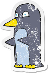 retro distressed sticker of a cartoon penguin