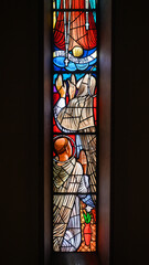 Mary giving the rosary to St Catherine of Siena and St Dominic. A part of larger stained-glass window in Igreja de Nossa Senhora de Fátima, Lisbon.