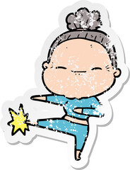 distressed sticker of a cartoon peaceful old woman