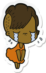 sticker of a cartoon crying girl
