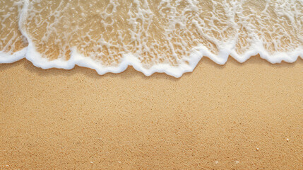 Foamy sea wave on a smooth sandy beach.