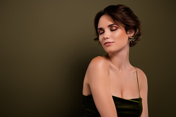 Fototapeta premium Photo of classy girlfriend with closed smoky eyes stand over green empty space background wearing style trend gown