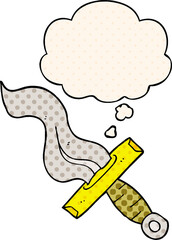cartoon dagger and thought bubble in comic book style