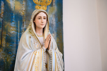 Statue of Our Lady of Fatima. Igreja de Nossa Senhora de Fátima (Church of Our Lady of Fatima) – Bairro Padre Cruz, Lisbon, Portugal.