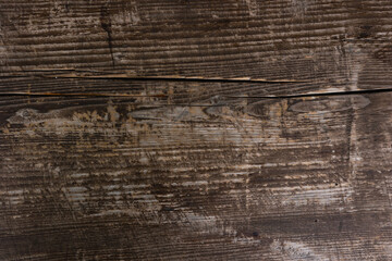 Texture of an old wooden log with a crack. Wooden background.