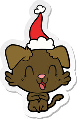 laughing sticker cartoon of a dog wearing santa hat