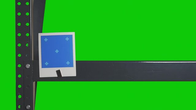 A female hand places Instant frames on a shelf using magnets. Chroma key and trackers for easy background replacement and adding custom images
