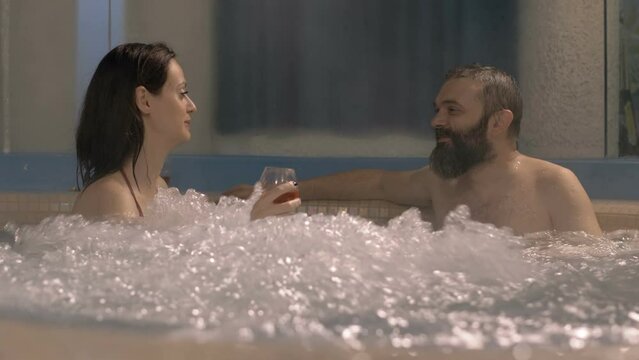 Couple in hot tub at home.Luxury lifestyle