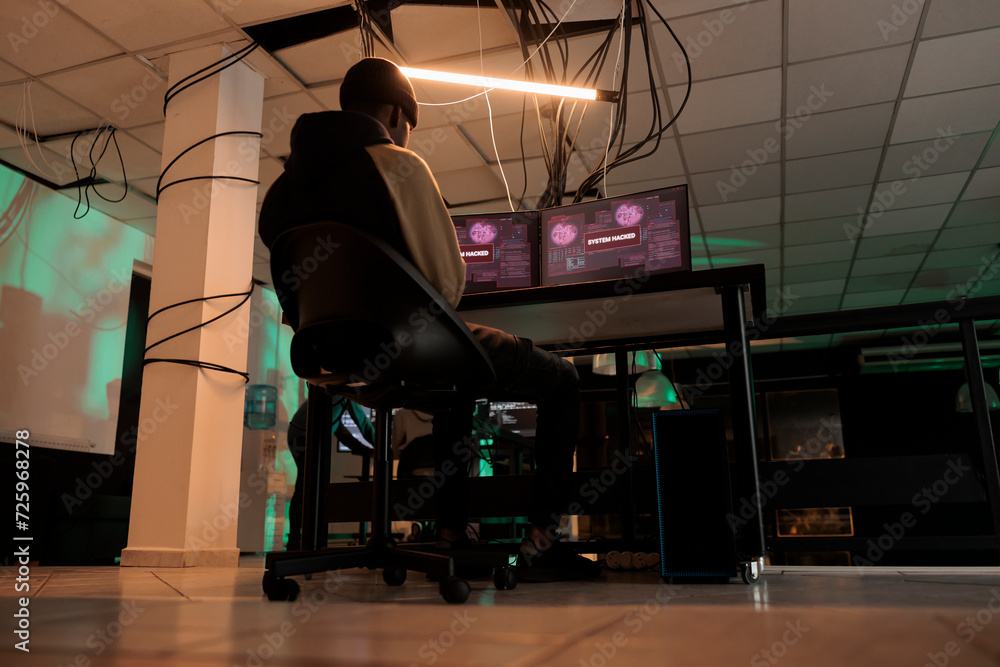 Poster professional hacker using encryption to break system, working on multiple monitors at night. young a