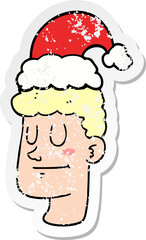 distressed sticker of a cartoon man wearing christmas hat