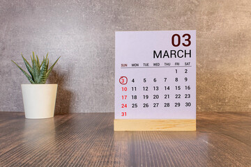 3 Marz on wooden grey cubes. Calendar cube date 03 March. Concept of date. Copy space for text or...
