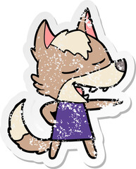 distressed sticker of a cartoon wolf laughing