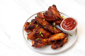 Spicy chicken  wings in bbq sauce , spicy chicken wings cooked in the air fryer