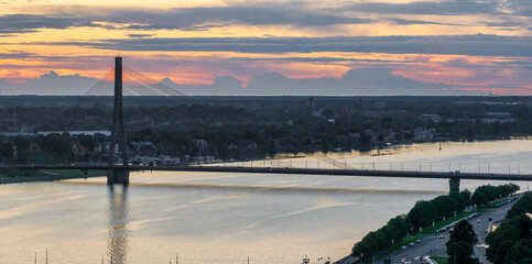 Beautiful aerial sunset over Rigafrom above. Panoramic view of the Riga old town, the capital of Latvia.