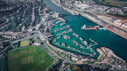 Aerial view of Newhaven industrial port with visible ships and yachts in town, Newhaven, East...