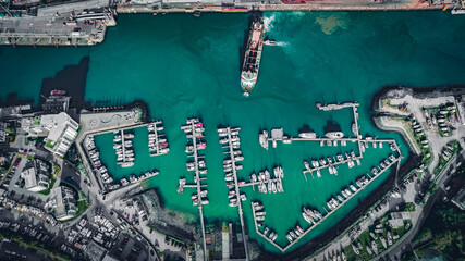 Aerial view of Newhaven industrial port with visible ships and yachts in town, Newhaven, East Sussex, UK