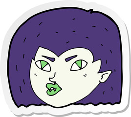 sticker of a cartoon vampire face