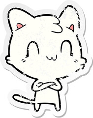 distressed sticker of a cartoon happy cat