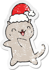 distressed sticker of a cute cartoon christmas cat