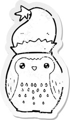 distressed sticker of a cute cartoon owl wearing christmas hat