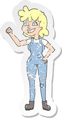 retro distressed sticker of a cartoon determined woman clenching fist