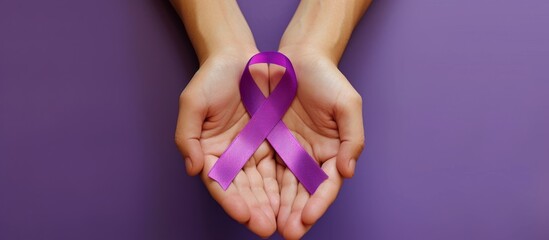 Woman hands holding domestic violence awareness ribbon close up on violet background, symbolizing the intersection of healthcare and social issues.