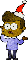textured cartoon of a staring man wearing santa hat