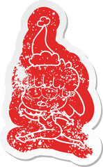 cartoon distressed sticker of a tired woman wearing santa hat