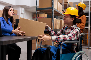 Postal service workers collaborating in warehouse and coordinating delivery. Asian distribution...