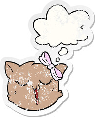 cartoon cat face and thought bubble as a distressed worn sticker