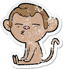 distressed sticker of a cartoon suspicious monkey
