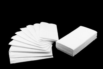 set of white napkins on a black background