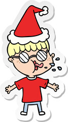 sticker cartoon of a boy wearing spectacles wearing santa hat