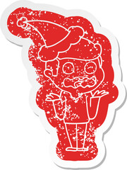 cartoon distressed sticker of a man totally stressed out wearing santa hat