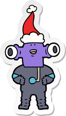 friendly sticker cartoon of a alien wearing santa hat