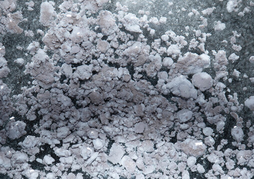 Silver chloride (AgCl) darkened from light, the product of the reaction of silver nitrate with sodium chloride, decanted and dried.