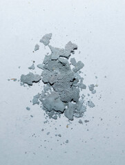 Silver chloride (AgCl) darkened from light, the product of the reaction of silver nitrate with sodium chloride, decanted and dried.