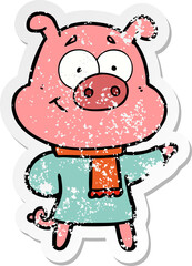 distressed sticker of a happy cartoon pig wearing warm clothes