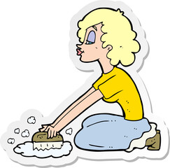 sticker of a cartoon woman scrubbing floor